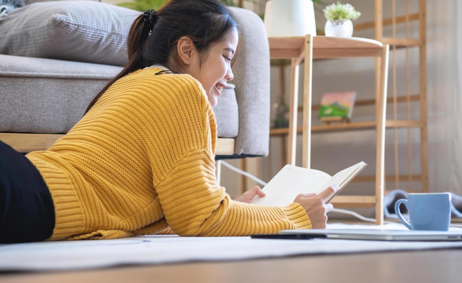 Clean desk setup with laptop, notebook, and proper lighting for remote learning