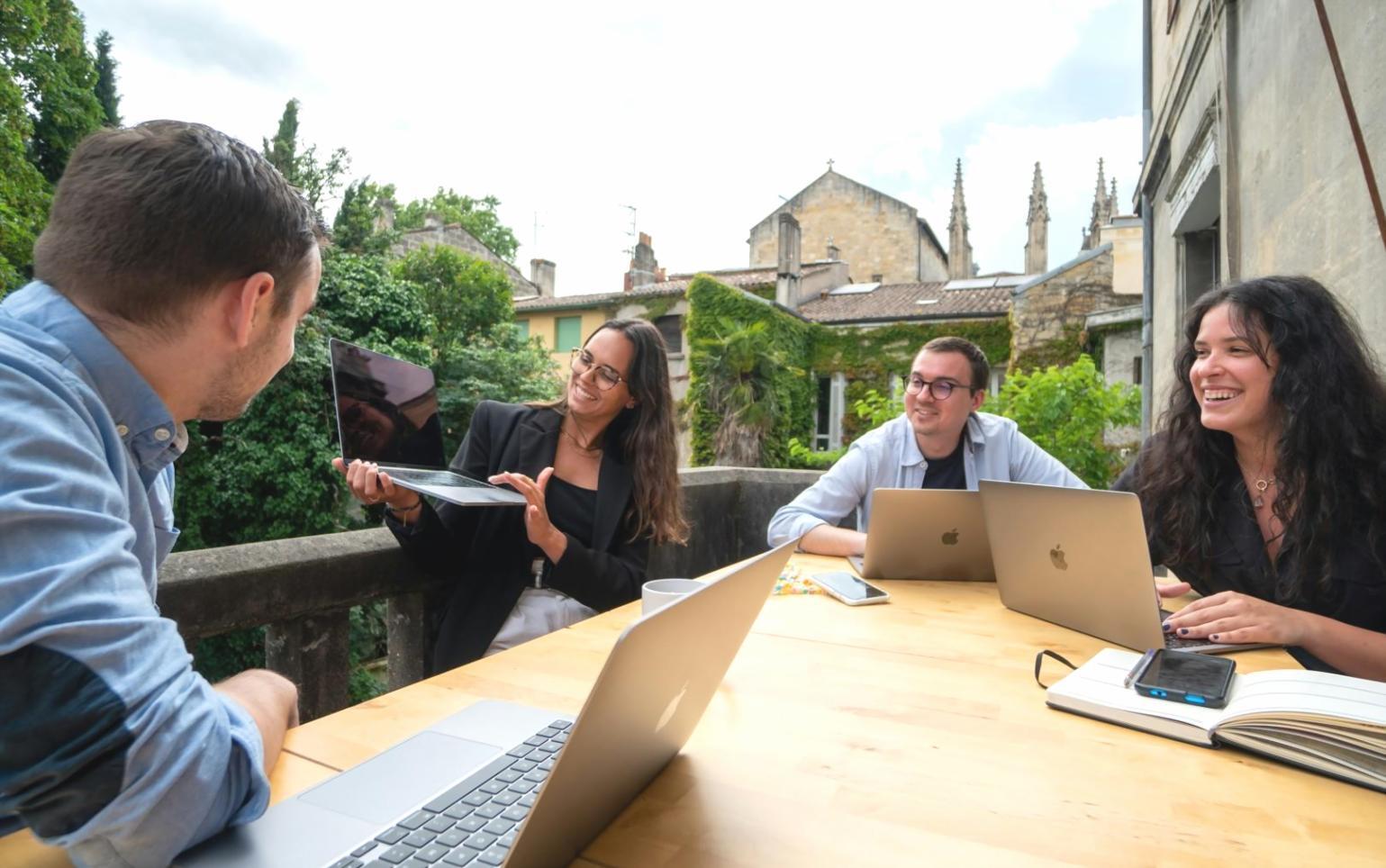 Students collaborating on interface design projects in modern learning environment